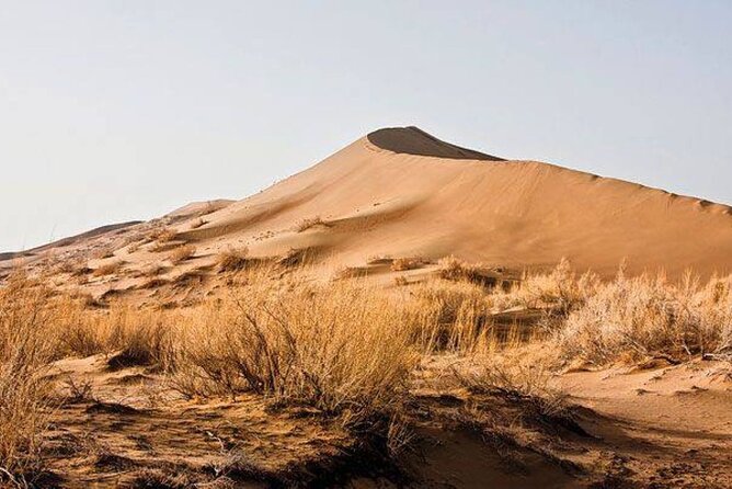 2 day tour to Altyn Emel Singing Dune and Aktau mountain - Katutau volcanic formations: wind-carved rocks in a short stop